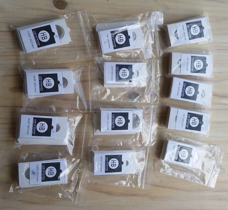 A large selection of Hartbergers self-adhesive coin flips (unused)