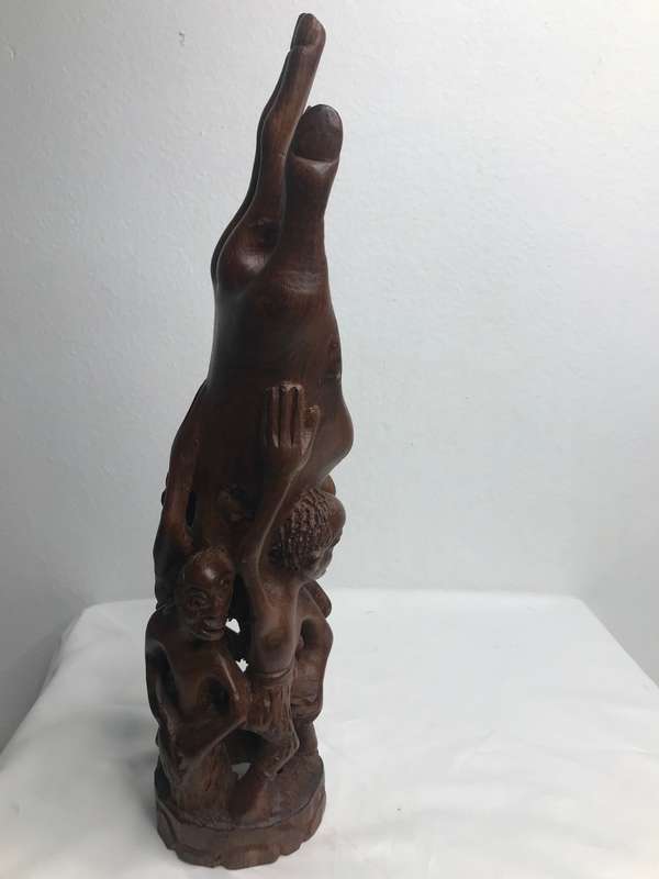 Wood Art Hand Carved Sculpture in Ebony one Piece Family holding up a Hand 35cm x 10cm