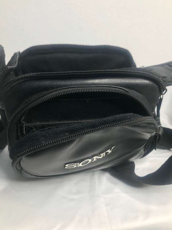 Sony Camera Bag Black Leather second hand front pocket, divider inside one zip off track
