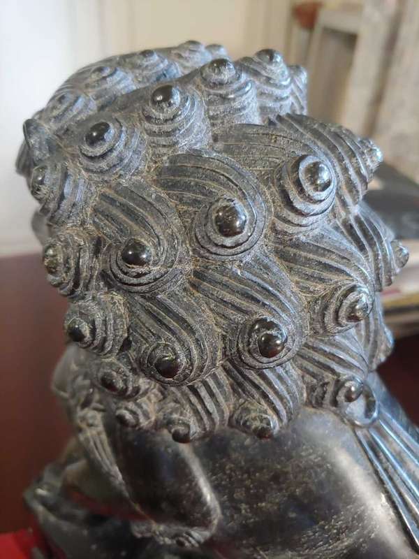 A pair of Antique Chinese Foo Dogs (Lions)