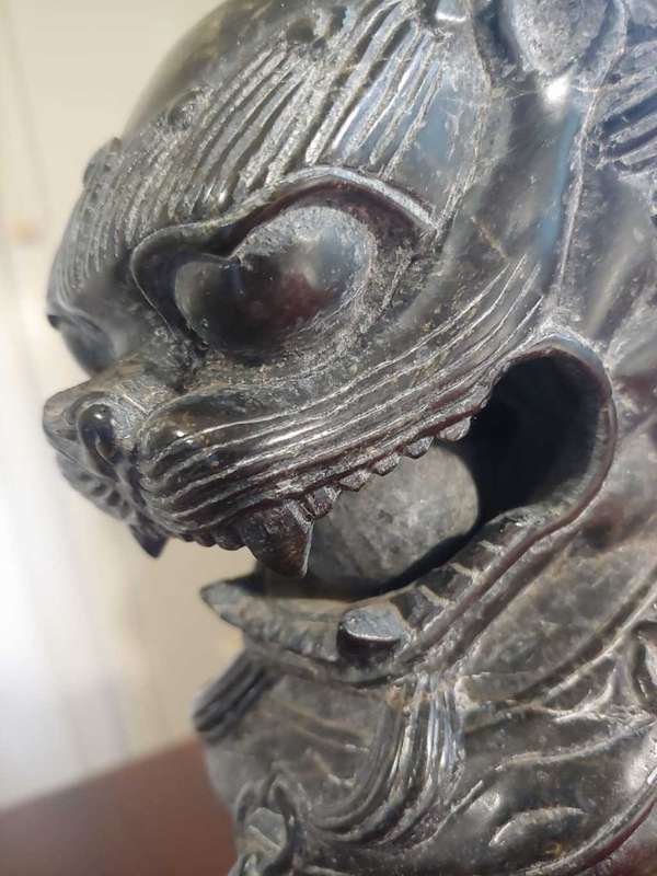 A pair of Antique Chinese Foo Dogs (Lions)