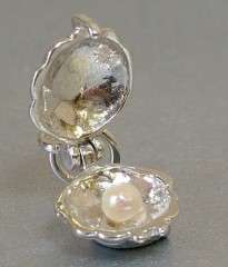 STERLING SILVER OPENING PEARL IN OYSTER CHARM