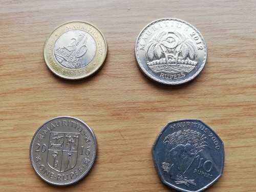 Set of mauritian coins including Bi metallic 20 Rupee and heptagonal 10 Rupee coin.