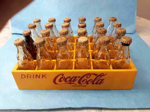 Coca Cola Vintage Miniature Crate with 24 Miniature Coke Bottles.1970-60`s  R 709.00 View scans
