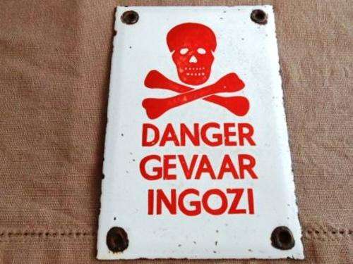 Small enamel danger sign