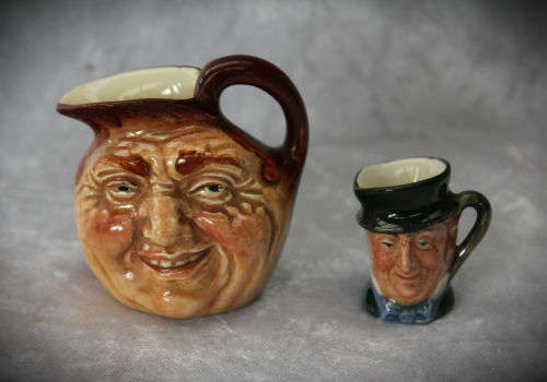 2 small Royal Doulton character jugs -John Barleycorn and Mr Micawber- 1 small paint chip