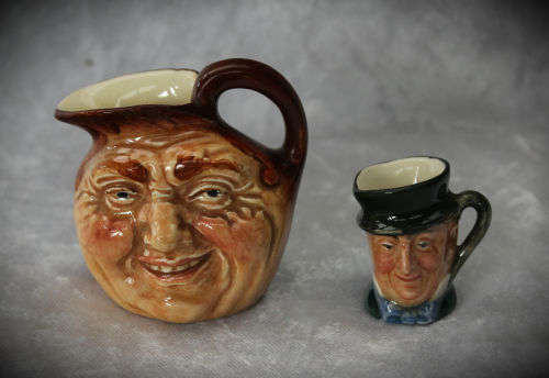 2 small Royal Doulton character jugs -John Barleycorn and Mr Micawber- 1 small paint chip
