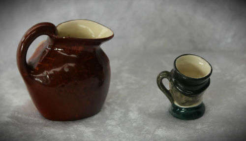 2 small Royal Doulton character jugs -John Barleycorn and Mr Micawber- 1 small paint chip