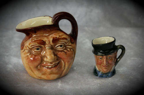 2 small Royal Doulton character jugs -John Barleycorn and Mr Micawber- 1 small paint chip