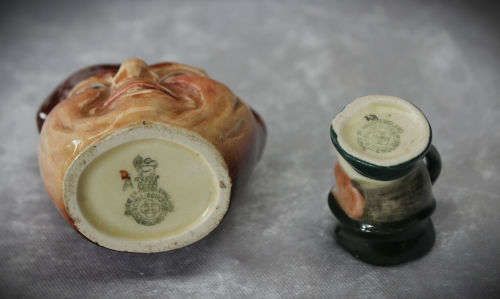 2 small Royal Doulton character jugs -John Barleycorn and Mr Micawber- 1 small paint chip