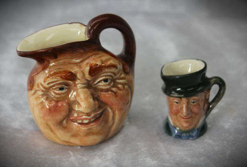 2 small Royal Doulton character jugs -John Barleycorn and Mr Micawber- 1 small paint chip