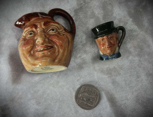 2 small Royal Doulton character jugs -John Barleycorn and Mr Micawber- 1 small paint chip