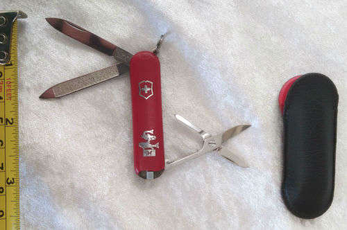 Vintage Victorinox Swiss  pocket knife with sheath - see condition piece of cover chipped off