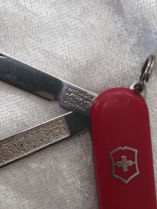 Vintage Victorinox Swiss  pocket knife with sheath - see condition piece of cover chipped off