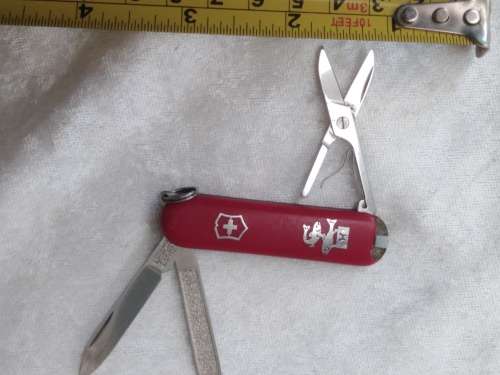 Vintage Victorinox Swiss  pocket knife with sheath - see condition piece of cover chipped off