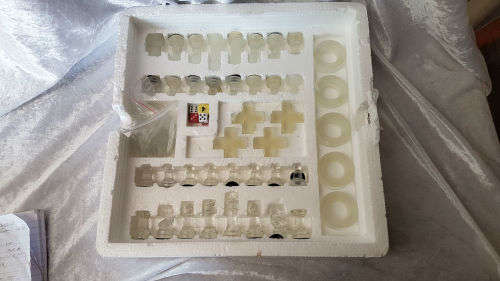 Set of 4 Glass Games -a few pieces have chips- still in box