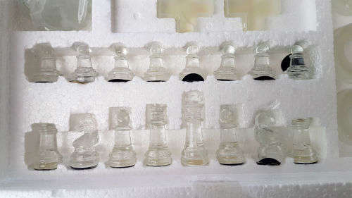Set of 4 Glass Games -a few pieces have chips- still in box