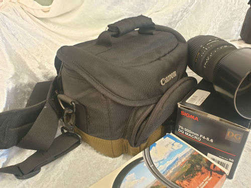 Canon E0S 550D Digital SLR Camera & Cannon EF-S 18-55 IS Lens Kit + Sigma 70-300mm Lens plus ..