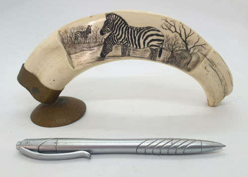 Zebra artwork on Warthog tooth on Brass stand