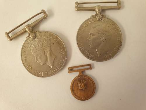 WW2  War Medal 19391945 and a Defence Medal member 327206 - plus a 1994 miniature medal
