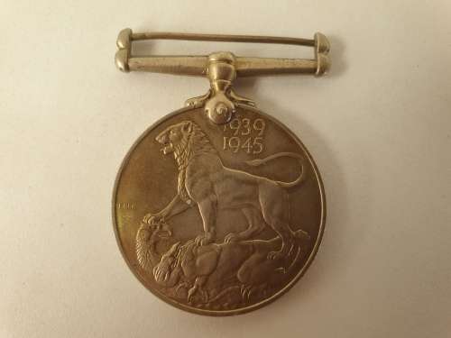 WW2  War Medal 19391945 and a Defence Medal member 327206 - plus a 1994 miniature medal