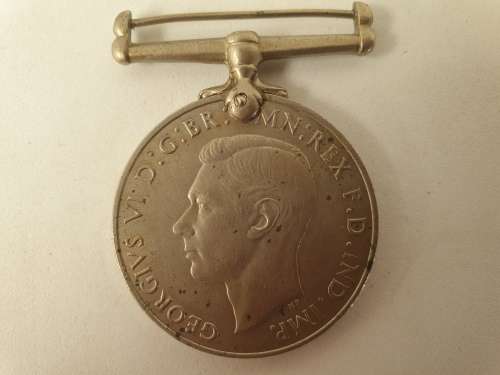 WW2  War Medal 19391945 and a Defence Medal member 327206 - plus a 1994 miniature medal