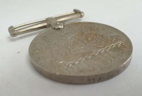 WW2  War Medal 19391945 and a Defence Medal member 327206 - plus a 1994 miniature medal