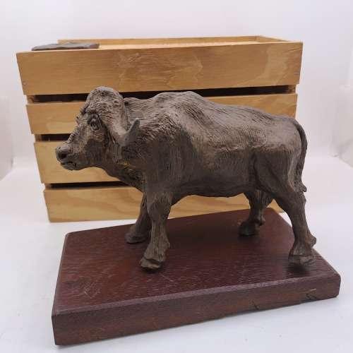 a Buffalo Figurine (Hand Made) in wooden Crate -ONE FOOT/HOOF BROKEN