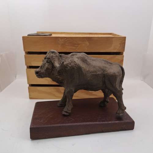 a Buffalo Figurine (Hand Made) in wooden Crate -ONE FOOT/HOOF BROKEN