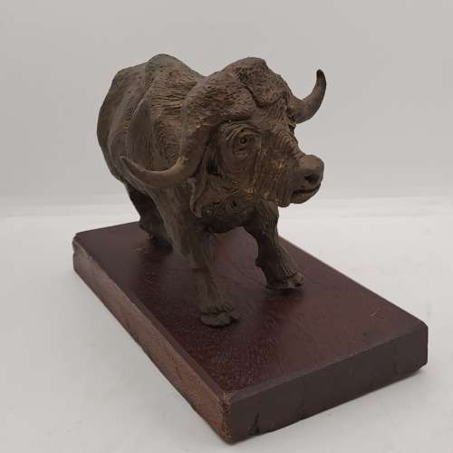 a Buffalo Figurine (Hand Made) in wooden Crate -ONE FOOT/HOOF BROKEN