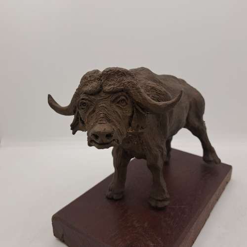 a Buffalo Figurine (Hand Made) in wooden Crate -ONE FOOT/HOOF BROKEN