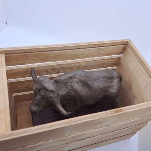 a Buffalo Figurine (Hand Made) in wooden Crate -ONE FOOT/HOOF BROKEN