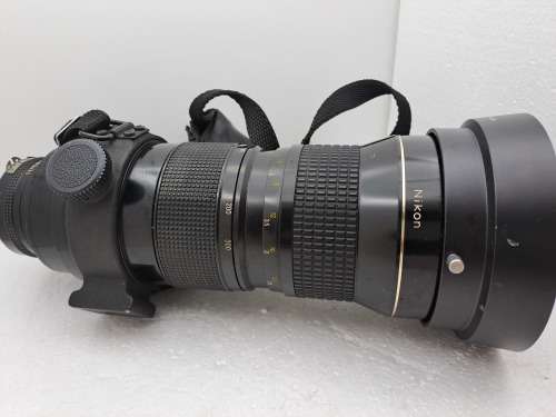 Pre-owned Vintage 1970`s Nikon Zoom Nikkor 50-300mm 1:4,5 with filter and cap