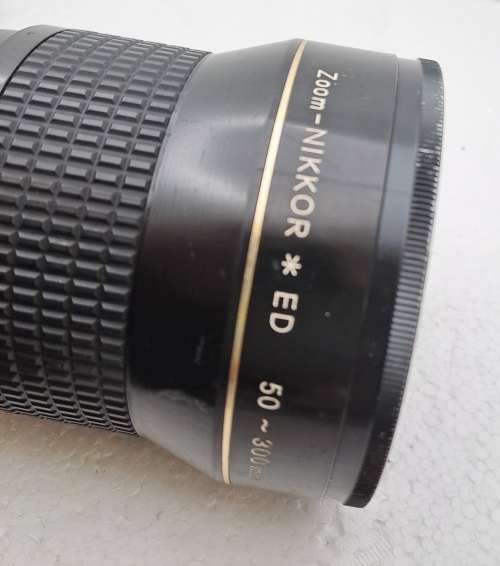Pre-owned Vintage 1970`s Nikon Zoom Nikkor 50-300mm 1:4,5 with filter and cap