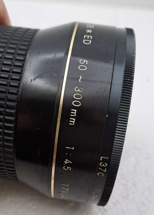 Pre-owned Vintage 1970`s Nikon Zoom Nikkor 50-300mm 1:4,5 with filter and cap