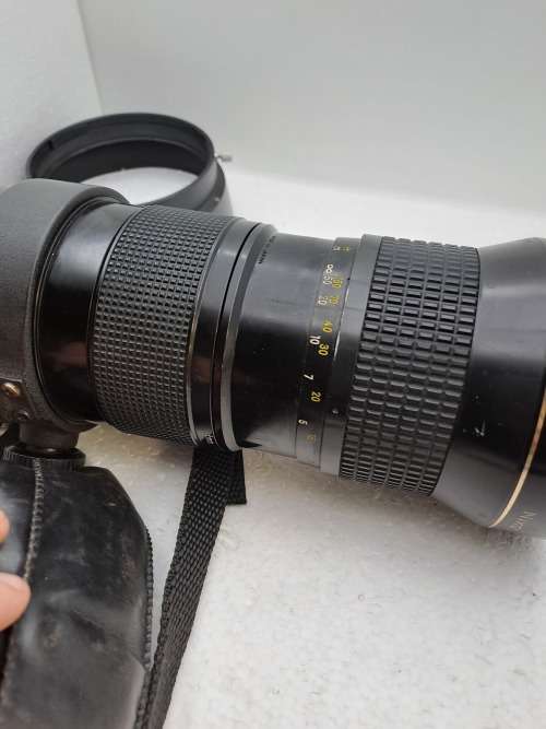 Pre-owned Vintage 1970`s Nikon Zoom Nikkor 50-300mm 1:4,5 with filter and cap