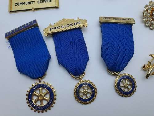 9 x Rotary International Items President and Past President Medals , Pins and Brooches
