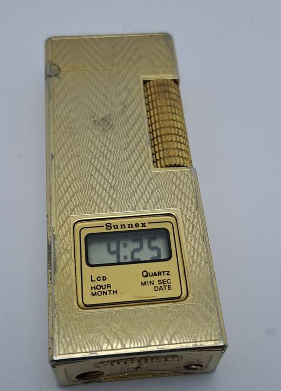 Vintage Sunnex lighter.. with Quartz Clock (Clock working) Lighter Not tested- made in Korea