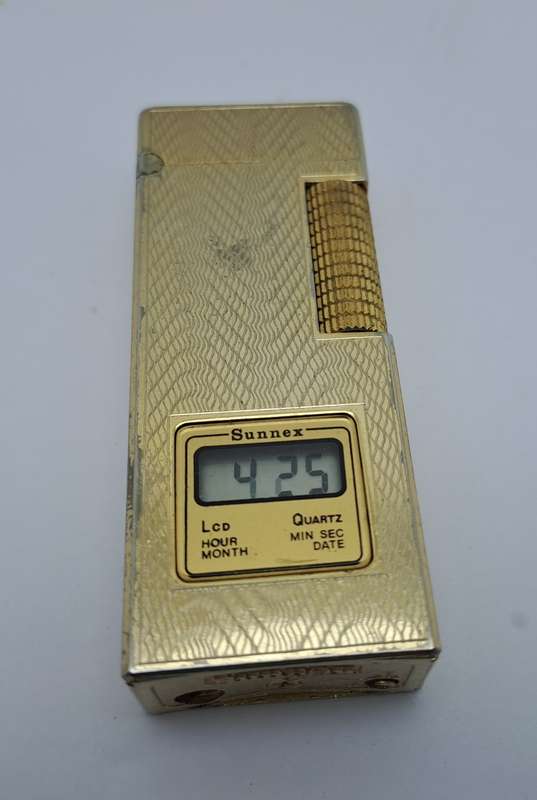 Vintage Sunnex lighter.. with Quartz Clock (Clock working) Lighter Not tested- made in Korea