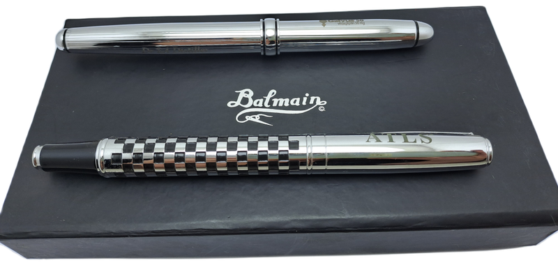 2 Pre-owned Balmain Ballpoint Pens -Boxed- Branded and one engraved -Ink is ok