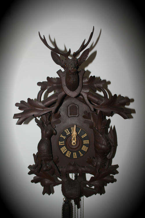 A Large Vintage BLACK FOREST Cuckoo Clock working ..only problem the  birds beak is broken