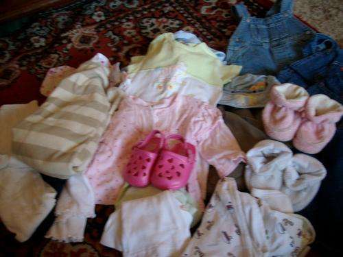 Box of baby clothes
