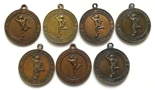 COMRADES MARATHON PIETERMARITZBURG TO DURBAN MEDAL 28MM ** 7 MEDALS**  **BID PER MEDAL**