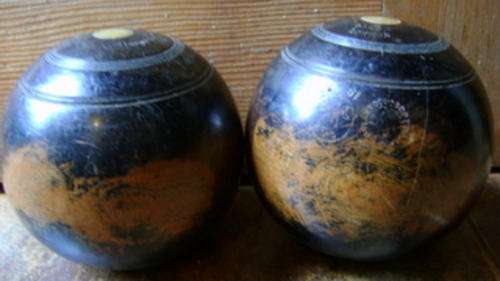 Pair of wooden bowling balls circa l927 Taylor Rolph Co Ltd Made in London Inset made of Brass