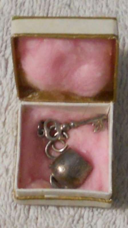 Silver key and cow bell