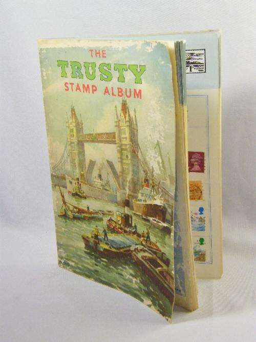 Vintage ` The Trusty ` stamp album with some stamps - as per photo