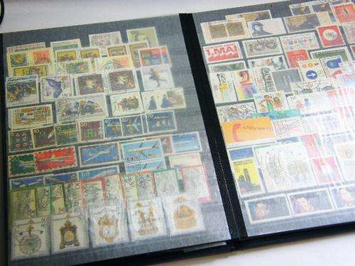 Stamp album with collection of more than 600 stamps - as per photo