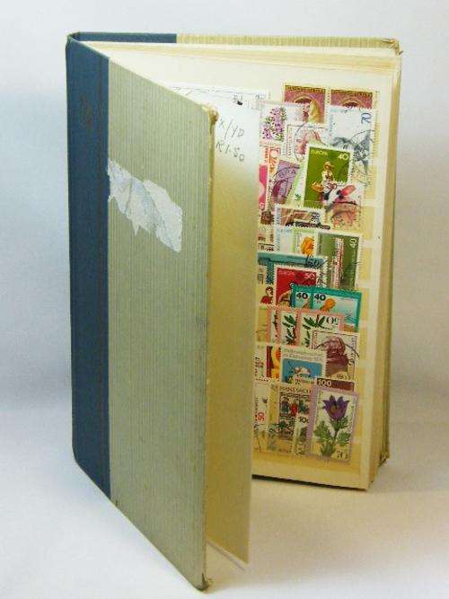 Stamp album with collection of more than 105 stamps - as per photo