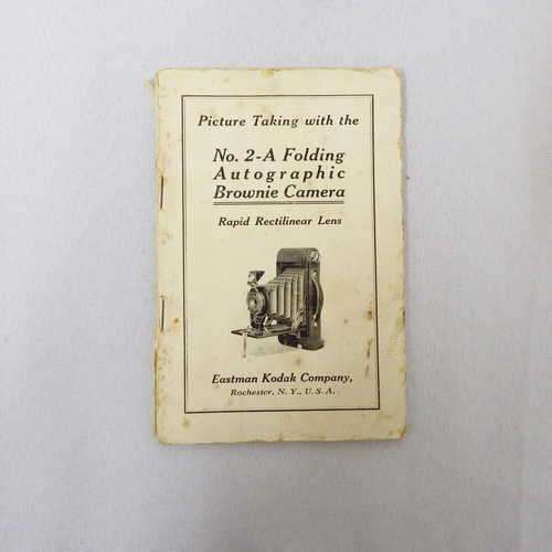 Picture taking with the no. 2-A folding autographic Brownie camera published by Eastman Kodak Co.