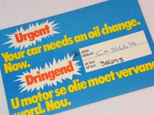 McCarthy motors advertising post card `Your car needs an oil change now`